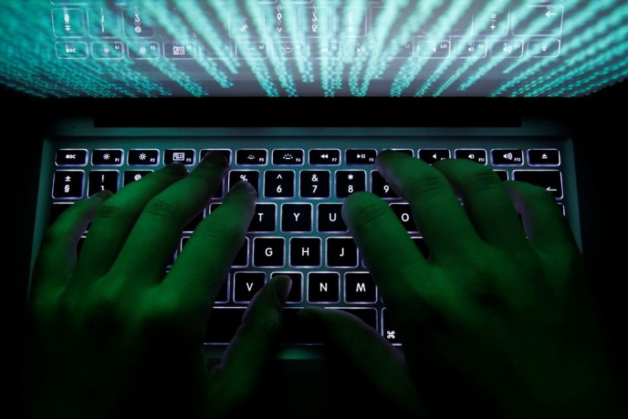 A man types on a computer keyboard in Warsaw in this February 28, 2013 illustration file picture — Reuters