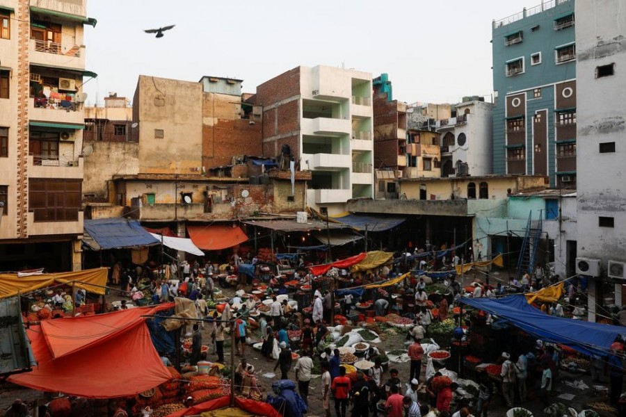 People shop at a crowded wholesale vegetable market after authorities eased coronavirus restrictions, following a drop in the coronavirus disease (Covid-19) cases, in the old quarters of Delhi, India on June 23, 2021 — Reuters/Files