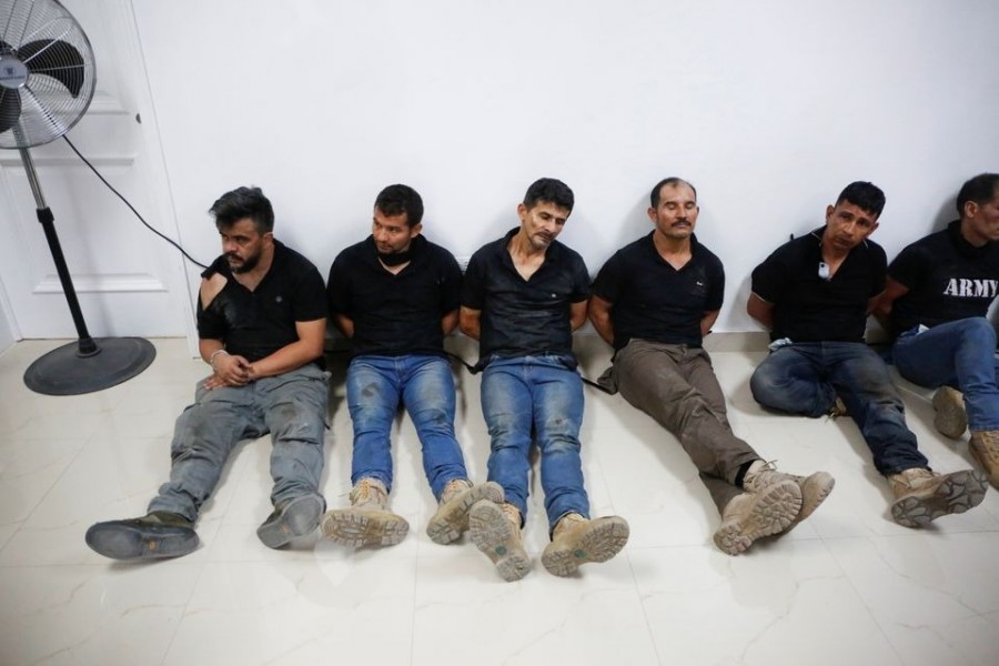 Suspects in the assassination of President Jovenel Moise, who was shot dead early Wednesday at his home, are shown to the media, in Port-au-Prince, Haiti on July 8, 2021 — Reuters photo