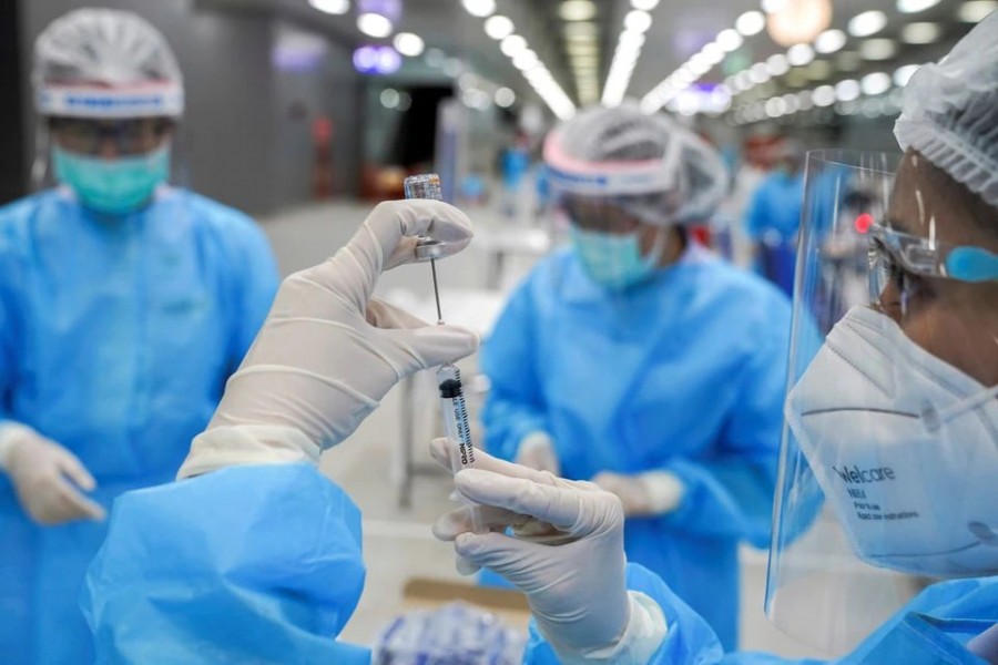 A medical worker prepares a syringe with a dose of China's Sinovac coronavirus disease (Covid-19) vaccine at the Central Vaccination Center, inside the Bang Sue Grand Station, in Bangkok, Thailand on May 24, 2021 — Reuters/Files