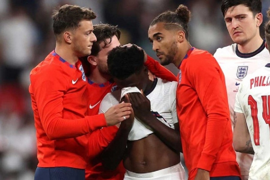 England's Bukayo Saka looks dejected after losing the penalty shootout as teammates console him Pool via REUTERS  Wembley Stadium, London, Britain - July 11, 2021 Britain's Prime Minister Boris Johnson with his wife Carrie Johnson after the match Pool via REUTERS Wembley Stadium, London, Britain - July 11, 2021 Britain's Prime Minister Boris Johnson with his wife Carrie Johnson after the match Pool via REUTERS