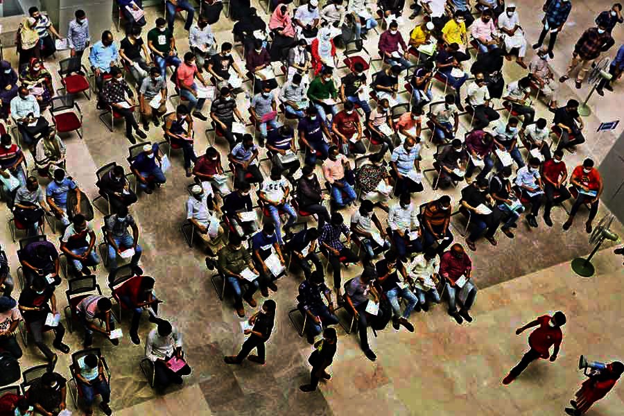 An aerial view shows people waiting for their turn to receive Covid jabs at the Bangabandhu Sheikh Mujib Medical University (BSMMU) in the city on Monday. With the virus infections rising, more people turn to the health facility to be vaccinated — FE photo