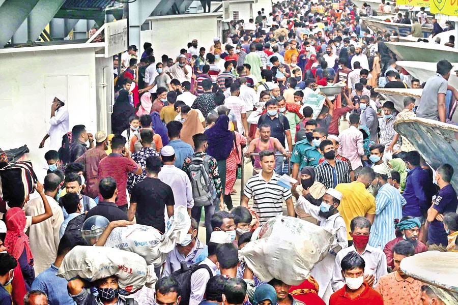 Amid the worsening Covid situation in the country, passengers gather at Shadarghat launch terminal on Friday without maintaining any health guidelines. The government has resumed launch services asking the authorities to ensure health safety protocols. But who cares? — FE photo by KAZ Sumon