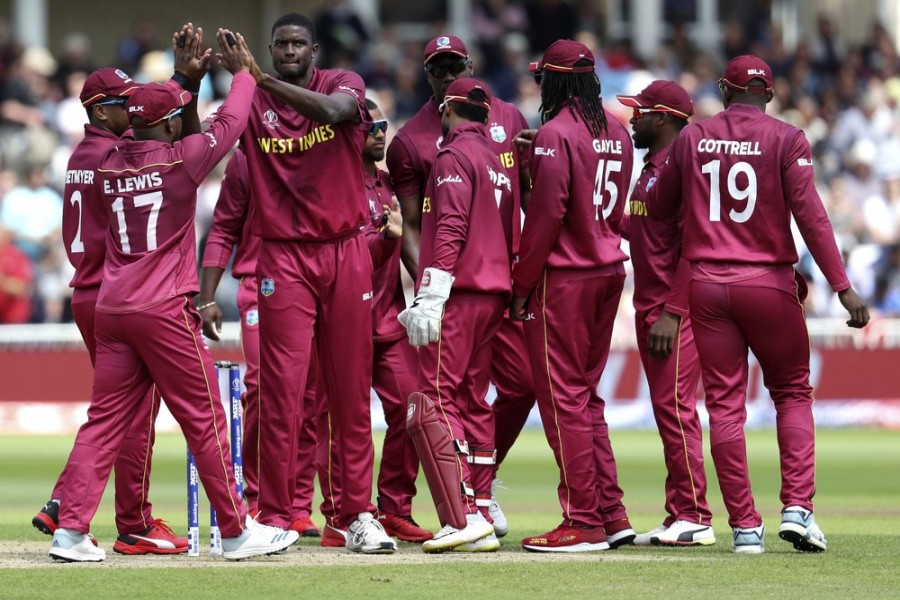 West Indies captain Jason Holder, 2nd left, celebrates after dismissing Australia's Marcus Stoinis during the Cricket World Cup match between Australia and West Indies at Trent Bridge in Nottingham, Thursday, June 6, 2019 — AP Photo