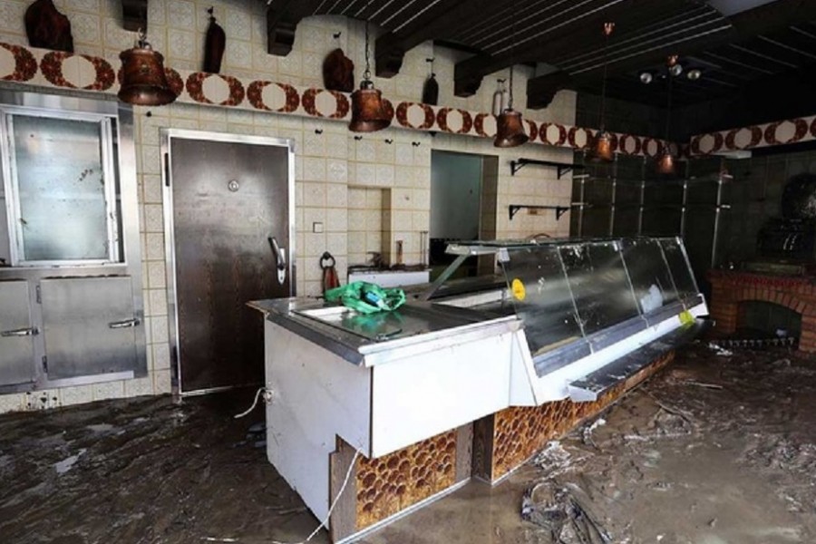 Mud covers the floor at a butchers' store following heavy rainfalls in Dernau, Germany, July 17, 2021. REUTERS/Wolfgang Rattay