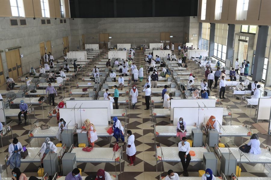 Photo shows officials and health professionals visiting the Bashundhara COVID-19 Isolation Hospital (Temporary Health Centre) shortly after its inauguration in Dhaka, Bangladesh on May 17, 2020. (Str/Xinhua)