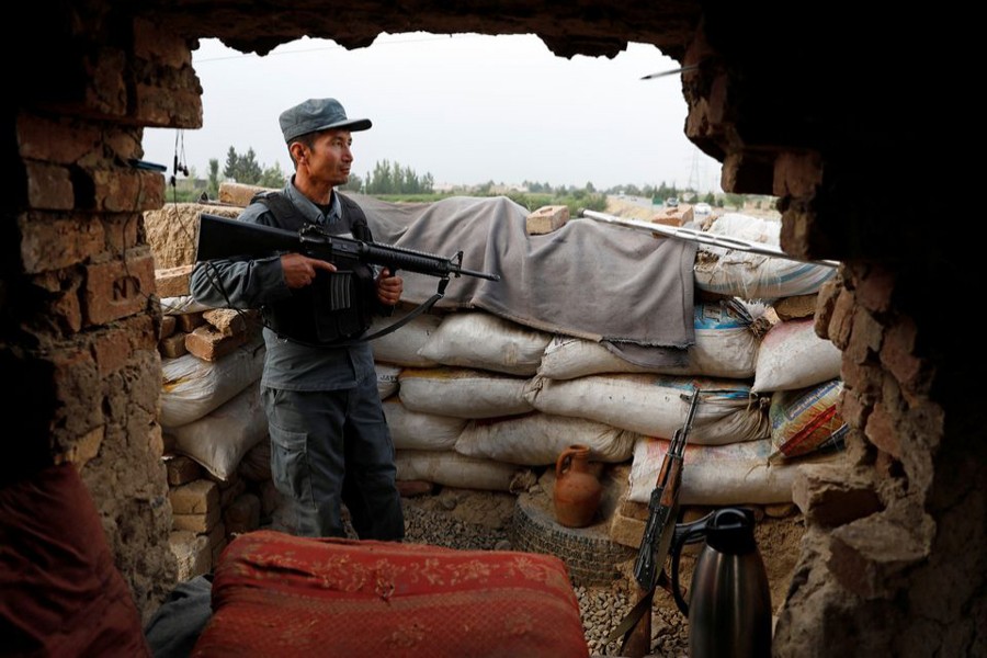 An Afghan policeman keeps watch at the check post on the outskirts of Kabul, Afghanistan on July 13, 2021 — Reuters/Files