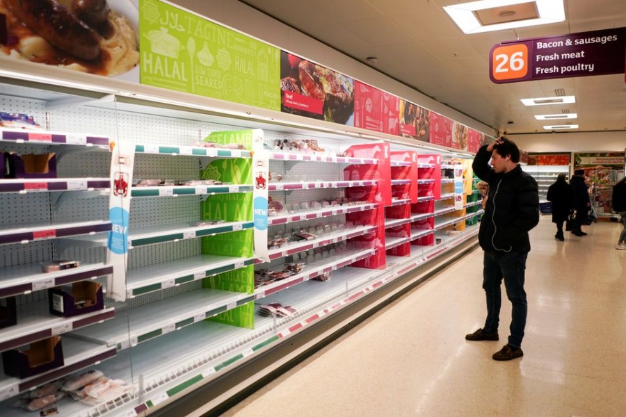 A man stands next to shelves empty of fresh meat in a supermarket, as the number of worldwide coronavirus cases continues to grow, in London, Britain, March 15, 2020. REUTERS/Henry Nicholls