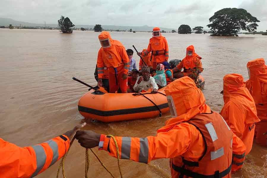 Torrential rains kill over 160 in India, dozens trapped in landslides