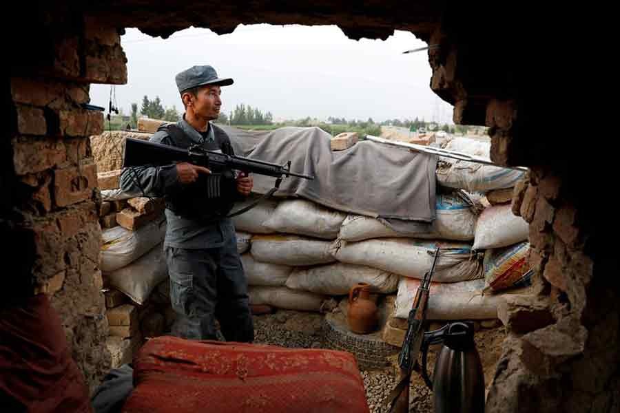 An Afghan policeman keeping watch at the check post on the outskirts of Kabul on July 13 this year -Reuters file photo