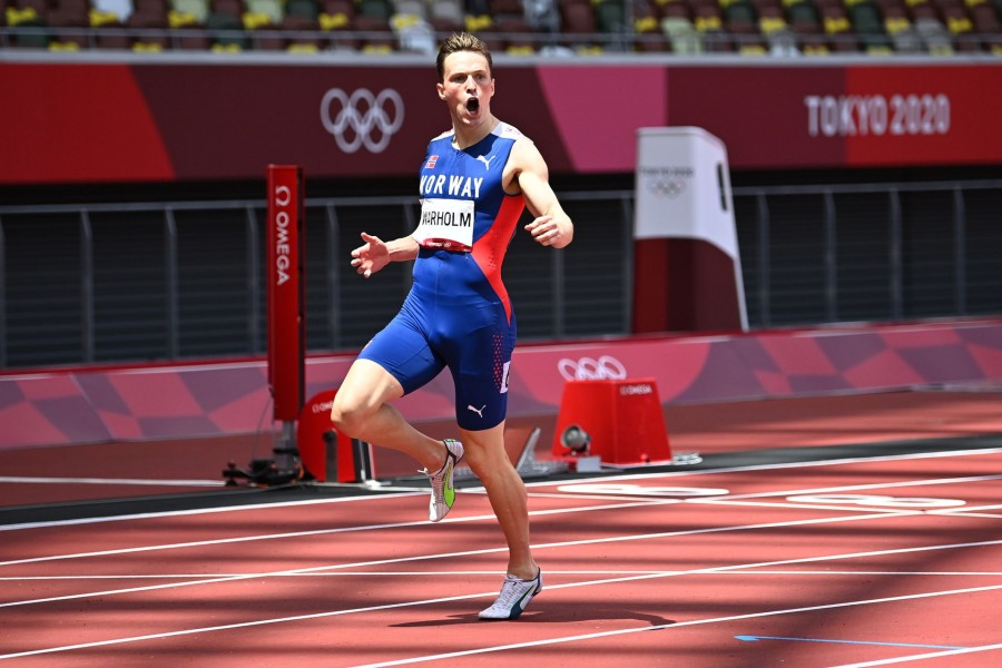 Tokyo 2020 Olympics - Athletics - Men's 400m Hurdles - Final - Olympic Stadium, Tokyo, Japan - August 3, 2021. Karsten Warholm of Norway celebrates after winning gold and setting a new world record REUTERS/Dylan Martinez