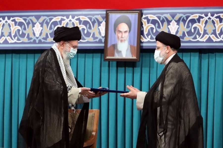 Iran's new President Ebrahim Raisi receives the endorsement decree for his presidency from Iran's Supreme Leader Ayatollah Ali Khamenei, in Tehran, Iran, August 3, 2021 — Reuters