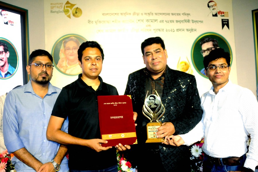 Senior Executive Director (Games and Sports) of Walton Group FM Iqbal Bin Anwar Dawn and Senior Deputy Operative Director Rabiul Islam Milton along with other officials pose with the crest and certificate of 'Sheikh Kamal National Sports Council Award-21'