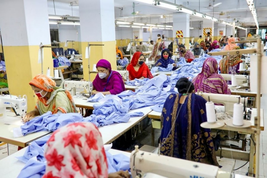 Women work in a garment factory, as factories reopened after the government has eased the restrictions amid concerns over the coronavirus disease (Covid-19) outbreak in Dhaka, Bangladesh on May 3, 2020 — Reuters/Files