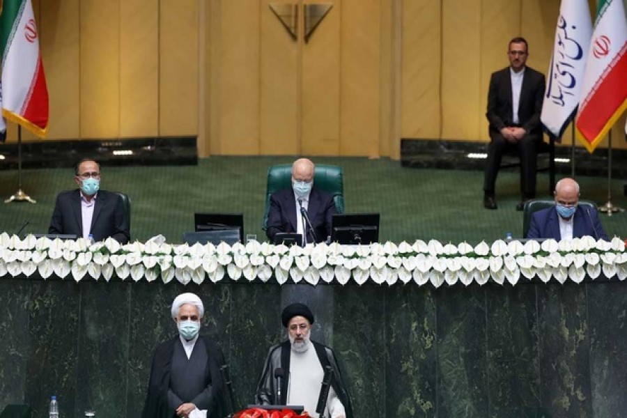 Iran's new President Ebrahim Raisi takes the oath during his swearing-in ceremony at the parliament in Tehran, Iran, August 5, 2021 — WANA via Reuters