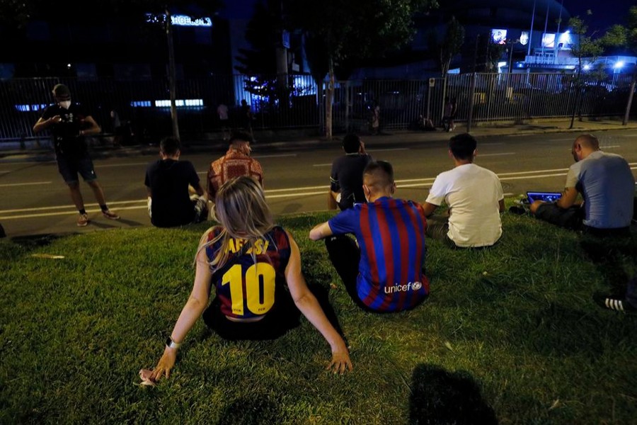 FC Barcelona fans are seen outside the Camp Nou after the club announced Lionel Messi's departure — Reuters photo