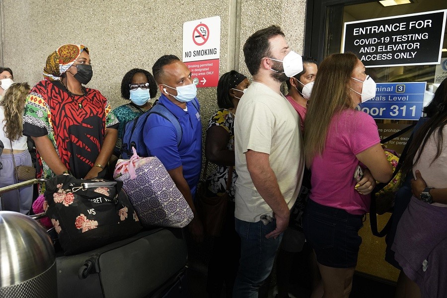 Passengers wait in a long line to get a Covid-19 test to travel overseas at Fort Lauderdale-Hollywood International Airport, Friday, Aug 6, 2021, in Fort Lauderdale, Fla – AP Photo