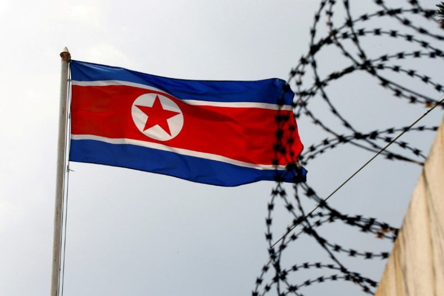 A North Korea flag flutters next to concertina wire at the North Korean embassy in Kuala Lumpur, Malaysia March 9, 2017. REUTERS/Edgar Su