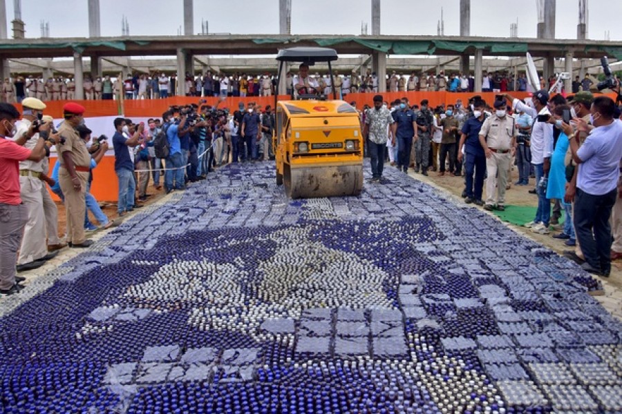 Himanta Biswa Sarma, Chief Minister of the northeastern state of Assam, uses a roller to destroy seized drugs during a ceremony in Nagaon district of Assam, India, July 18, 2021.