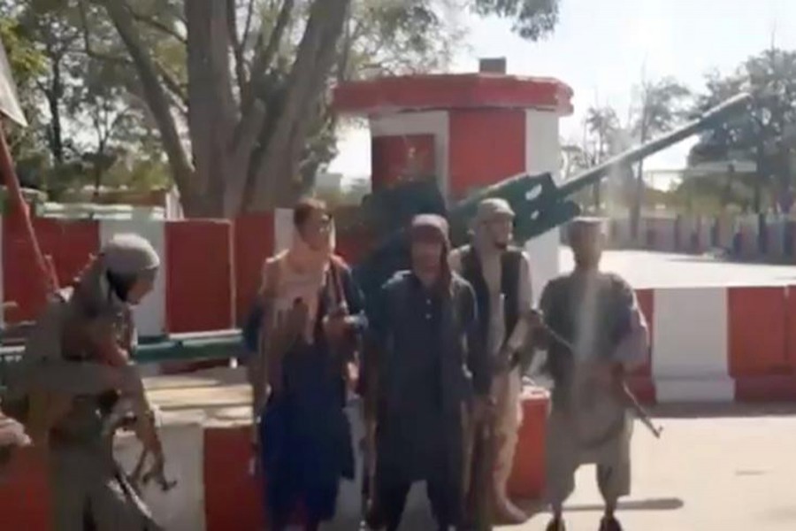 Taliban fighters gather on main road intersection in city of Ghazni, Afghanistan in this screen grab taken from a video released by the Taliban on August 12, 2021 — Taliban Handout/via REUTERS