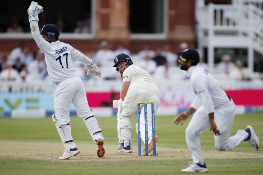 Cricket - Second Test - England v India - Lord's Cricket Ground, London, Britain - August 14, 2021 England's Jonny Bairstow in action as India's Rishabh Pant reacts Action Images via Reuters/Paul Childs