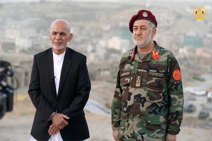 Afghanistan's President Ashraf Ghani and acting defence minister Bismillah Khan Mohammadi visit military corps in Kabul, Afghanistan August 14, 2021 — Afghan Presidential Palace/Handout via Reuters