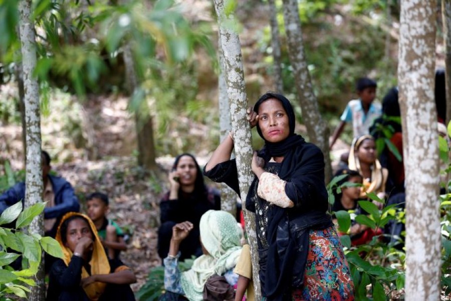 Rohingya woman wait  in Cox’s Bazar as they escaped persecution in Myanmar's Rakhine State — Reuters/Files