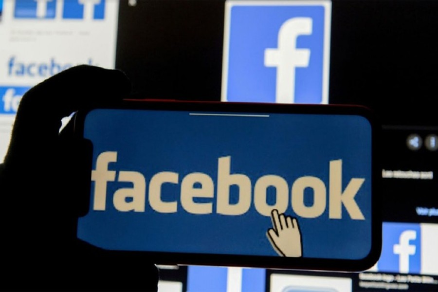 The Facebook logo is displayed on a mobile phone in this picture illustration taken December 2, 2019. Reuters