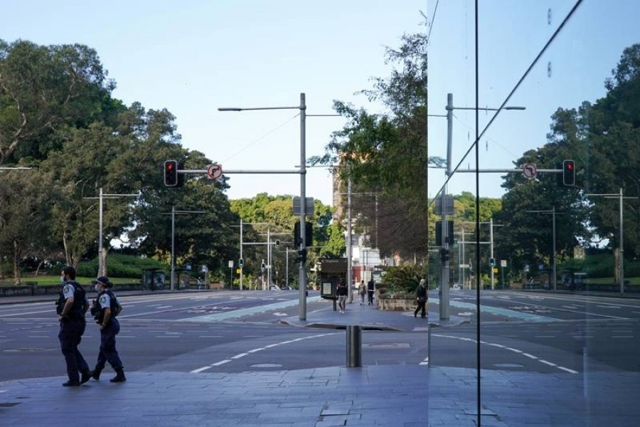 Police officers patrol the quiet city centre in Sydney during a lockdown to curb the spread of Covid — Reuters photo