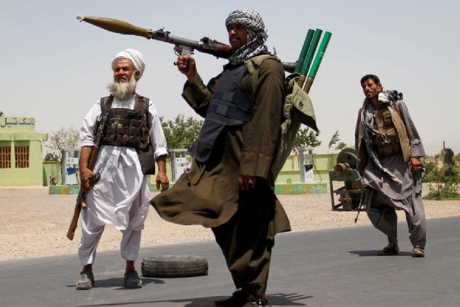 Former Mujahideen hold weapons to support Afghan forces in their fight against Taliban, on the outskirts of Herat province, Afghanistan July 10, 2021. Reuters