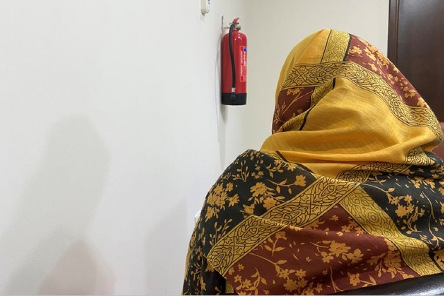 An evacuated Afghan woman, concealing her identity over concerns for family safety in Afghanistan, speaks during an interview with Reuters at a residential compound in Doha, Qatar August 21, 2021. REUTERS