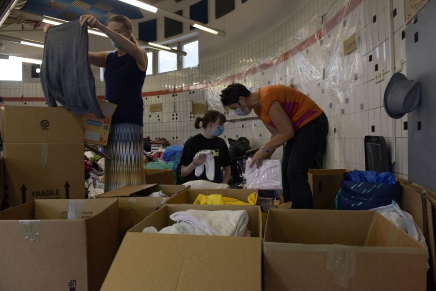 Civilian volunteers sort donations for evacuees from Afghanistan at Ramstein Air Base, Germany, August 22, 2021. Airman 1st Class Madelyn Keech/U.S. Air Force/Handout via REUTERS