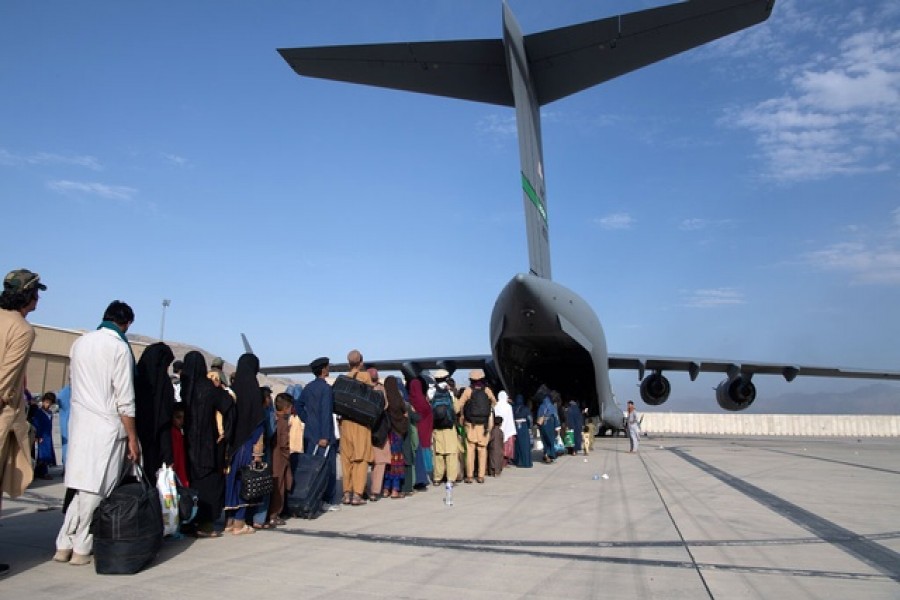 S Air Force loadmasters and pilots assigned to the 816th Expeditionary Airlift Squadron, load passengers aboard a US Air Force C-17 Globemaster III in support of the Afghanistan evacuation at Hamid Karzai International Airport in Kabul, Afghanistan, August 24, 2021 — Reuters