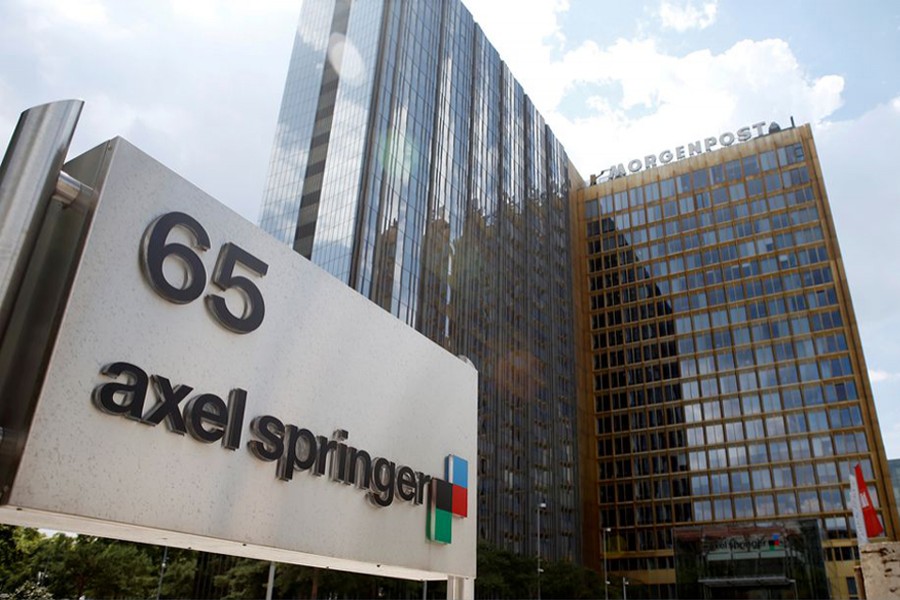 The logo of German publisher Axel Springer is pictured in front of the company's headquarters in Berlin on July 25, 2013 — Reuters/Files