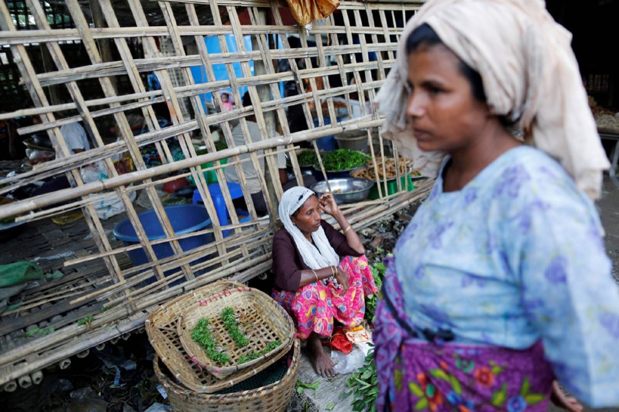 A woman sells food at the internally displaced persons camp for Rohingya people outside Sittwe in the state of Rakhine, Myanmar on November 15, 2016 — Reuters/Files