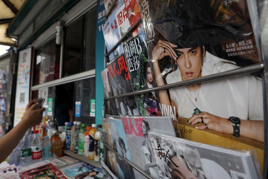 Singer-actor Kris Wu is seen on the cover of a fashion magazine at a newsstand in Beijing, China, July 20, 2021 — Reuters