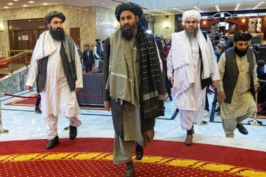 Mullah Abdul Ghani Baradar, the Taliban's deputy leader and negotiator, and other delegation members attend the Afghan peace conference in Moscow, Russia, March 18, 2021 — Alexander Zemlianichenko/Pool via Reuters