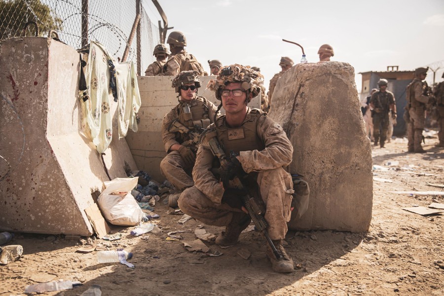 US Marines take a moment to rest at an Evacuation Control Checkpoint during an evacuation at Hamid Karzai International Airport, Kabul, Afghanistan on August 20, 2021 — US Marines Handout Via Reuters