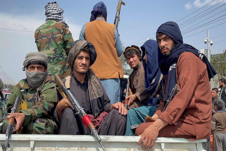 Taliban forces patrol near the entrance gate of Hamid Karzai International Airport, a day after US troops withdrawal, in Kabul, Afghanistan August 31, 2021. REUTERS/Stringer