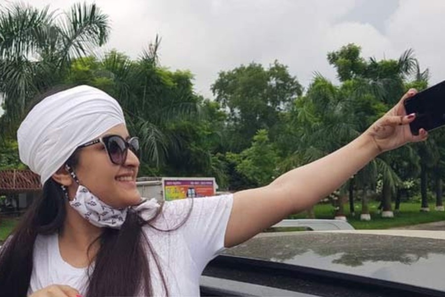 Actress Pori Moni takes a selfie on her mobile phone following her release from Kashimpur Central Women’s Prison on Wednesday, September 1, 2021.