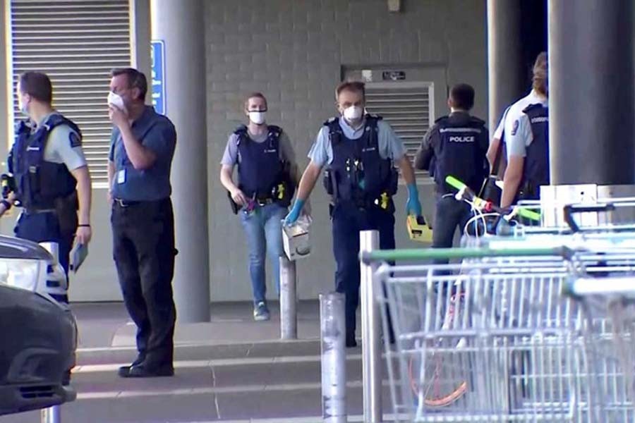 A screen grab shows police officers working outside a shopping mall following a knife attack in Auckland, New Zealand September 3, 2021. TVNZ via Reuters TV