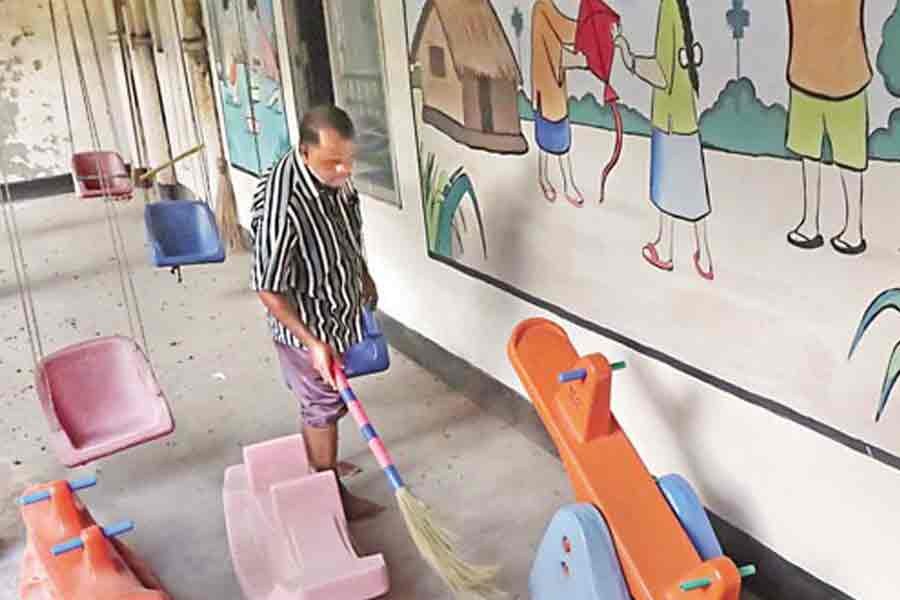 A staffer is busy cleaning the play corner of Begum Rahima Adarsha Balika Uchcha Bidyalaya in the Topkhana Road area of the capital on Friday, following the government's decision to reopen schools and colleges from September 12 —FE photo by Shafiqul Alam