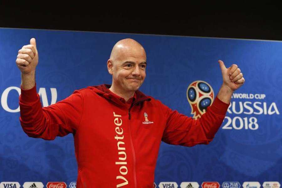 FIFA President Gianni Infantino greets the audience as he attends a news conference at the Luzhniki Stadium in Moscow, Russia July 13, 2018. REUTERS/Sergei Karpukhin