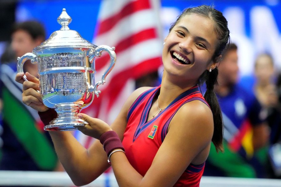 Sep 11, 2021; Flushing, NY, USA; Emma Raducanu of Great Britain celebrates with the championship trophy after her match against Leylah Fernandez of Canada (not pictured) in the women's singles final on day thirteen of the 2021 US Open tennis tournament at USTA Billie Jean King National Tennis Center. Mandatory Credit: Robert Deutsch-USA TODAY Sports