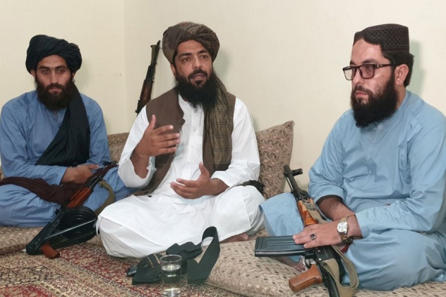 Waheedullah Hashimi (C), a senior Taliban commander, gestures as he speaks with Reuters during an interview at an undisclosed location near Afghanistan-Pakistan border August 17, 2021 —  Reuters/Stringer