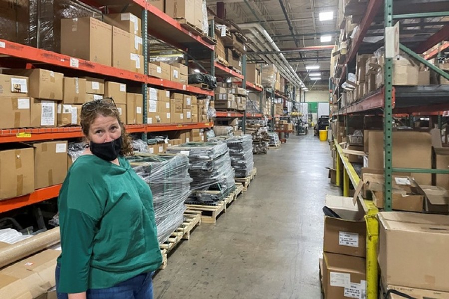 Diamond Brand COO Lauren Rash stands in an aisle of shelves with stockpiled parts as the 'lean' supply management has been upended by global shortages and bottlenecks, at Diamond Brand factory in Fletcher, outside Asheville, North Carolina, US August 11, 2021. Reuters