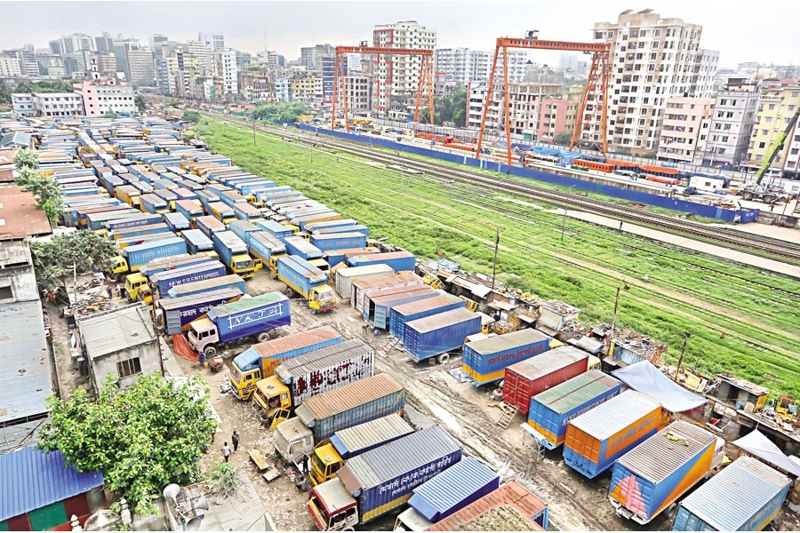 Covered vans, used to transport goods across the country, lie idle at Tejgaon Truck Stand in the city as owners of trucks and covered vans and their workers enforced a strike from 6:00am on Tuesday — FE photo by KAZ Sumon