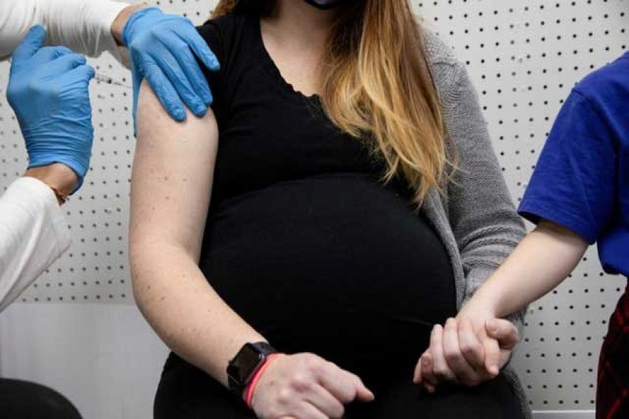 A pregnant woman receives a vaccine for the coronavirus disease (Covid-19) at Skippack Pharmacy in Schwenksville, Pennsylvania, US, February 11, 2021 — Reuters/Hannah Beier/File Photo