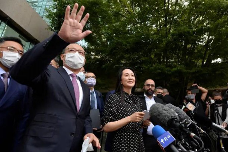 Speaking to supporters and reporters on the steps of the court afterward, Meng thanked the judge for her 'fairness' and talked of how the case had turned her life 'upside down' [Jennifer Gauthier/Reuters]   