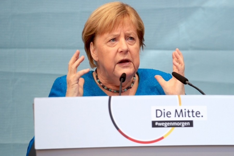 German Chancellor Angela Merkel together with North Rhine-Westphalia State Premier, Christian Democratic Union (CDU) party leader and candidate for chancellor Armin Laschet, attends a rally ahead of the September 26 general election, in Aachen, Germany, September 25, 2021 -- Reuters/Wolfgang Rattay